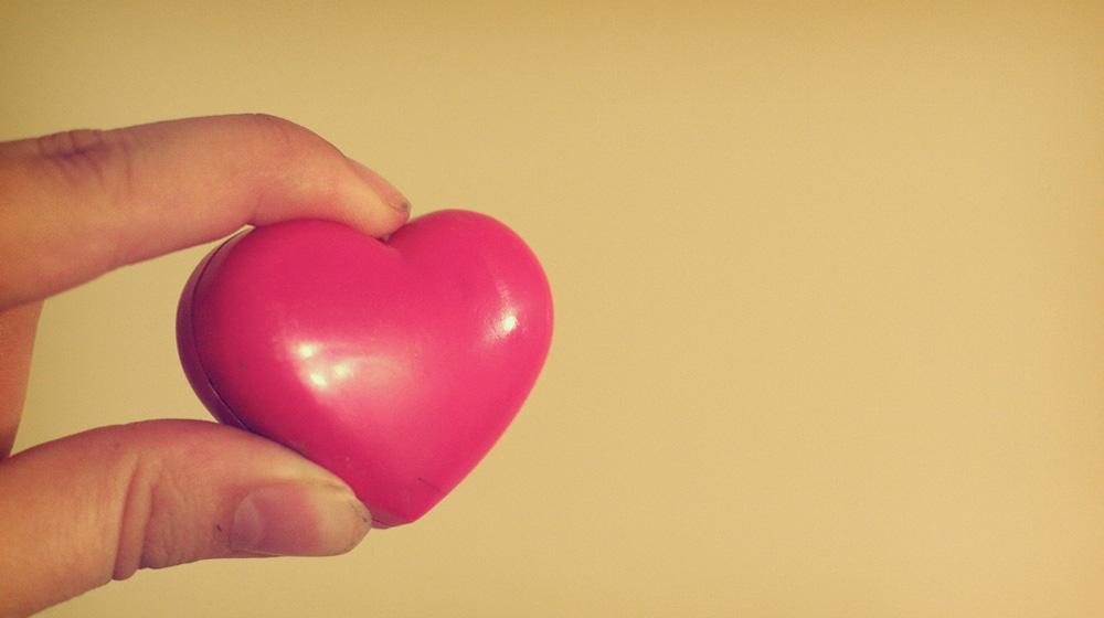 hand holding heart to represent doing pro bono work