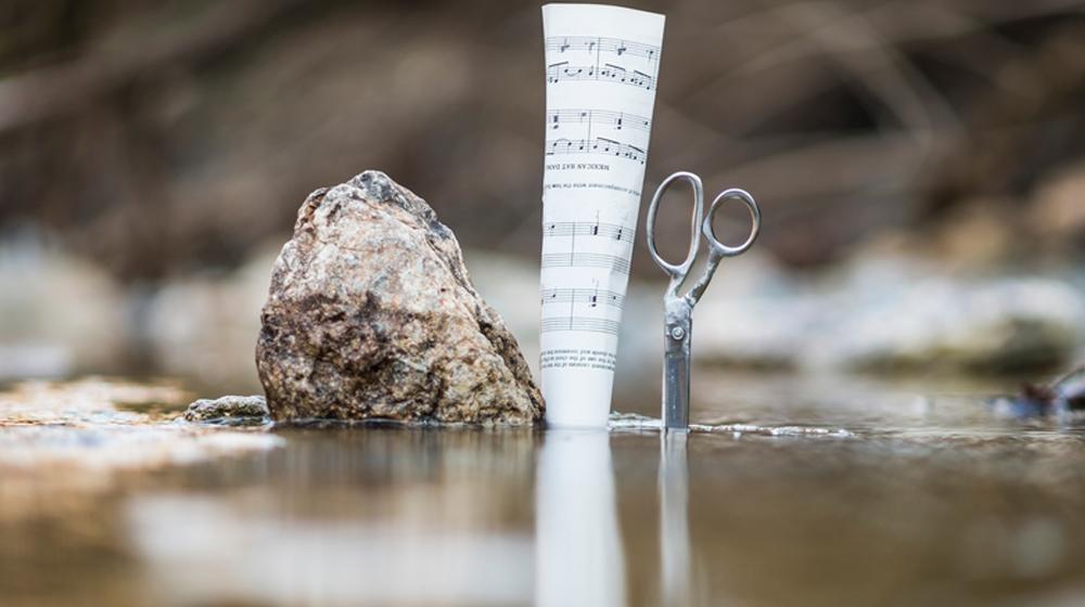 rock, paper and scissors to represent negotiating when it's time to buy a domain from someone else