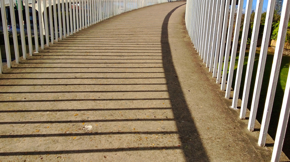 straight line shadows on sidewalk to represent straight lines when writing clean code
