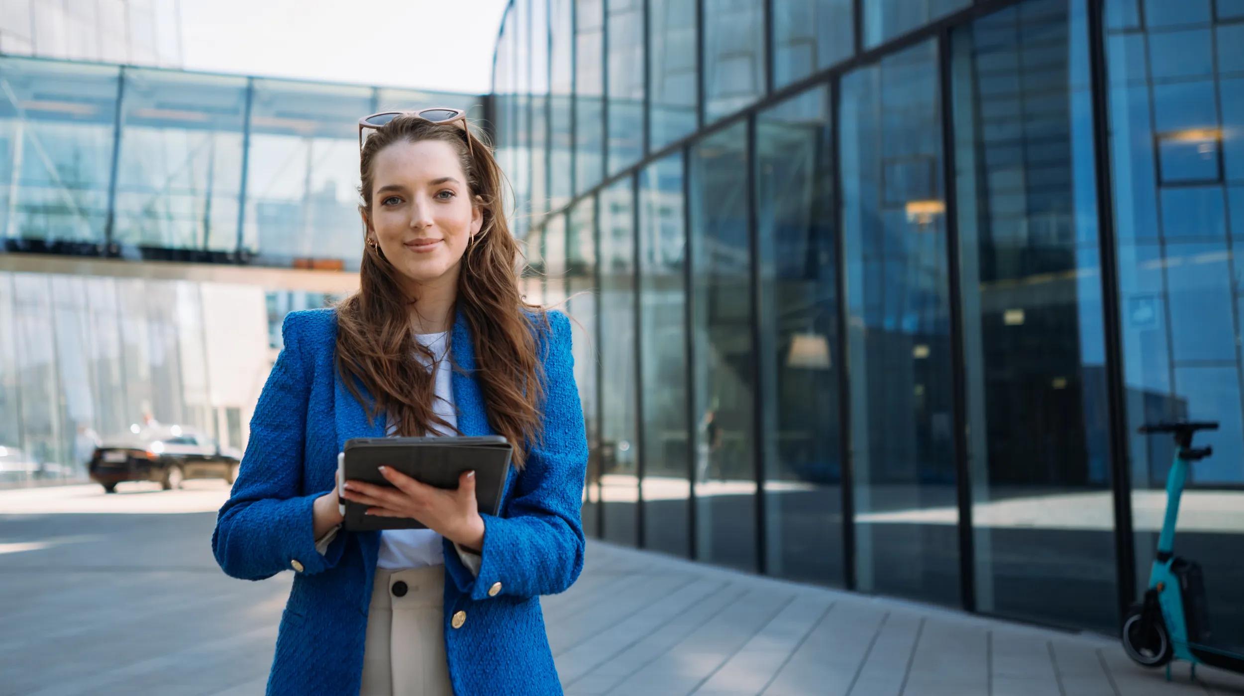 a woman holding a tablet