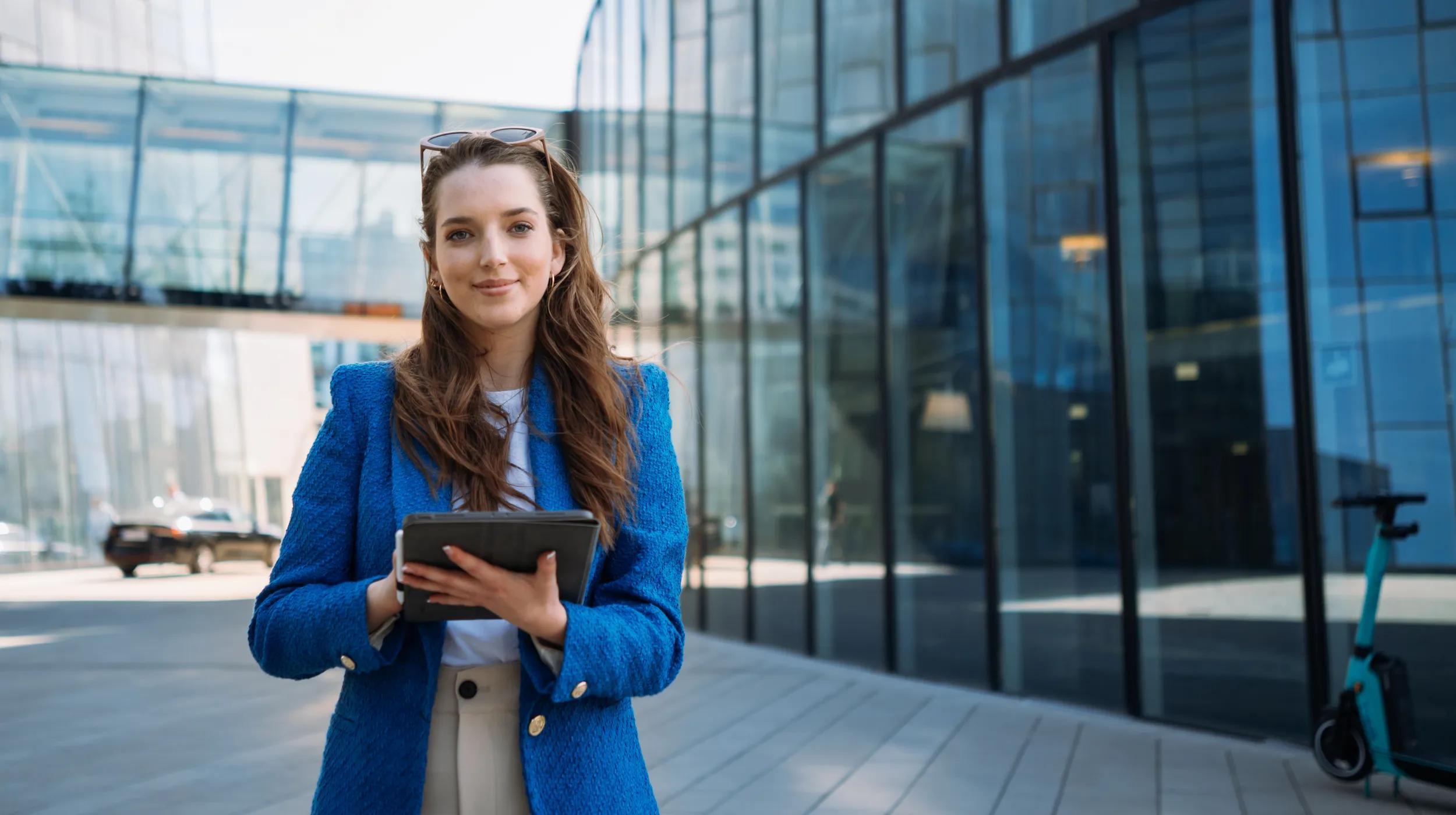 a woman holding a tablet