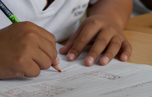 Small Child Working On Math Homework