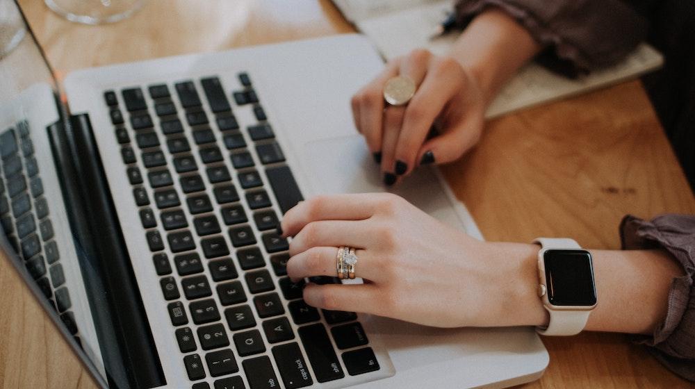 Person typing on laptop