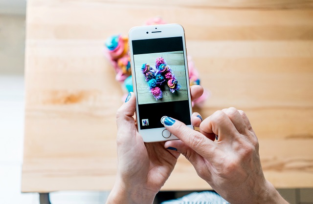 Person Taking A Photo Of Their Creation