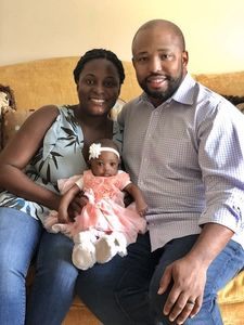 Erin King-Mullins with her husband and baby