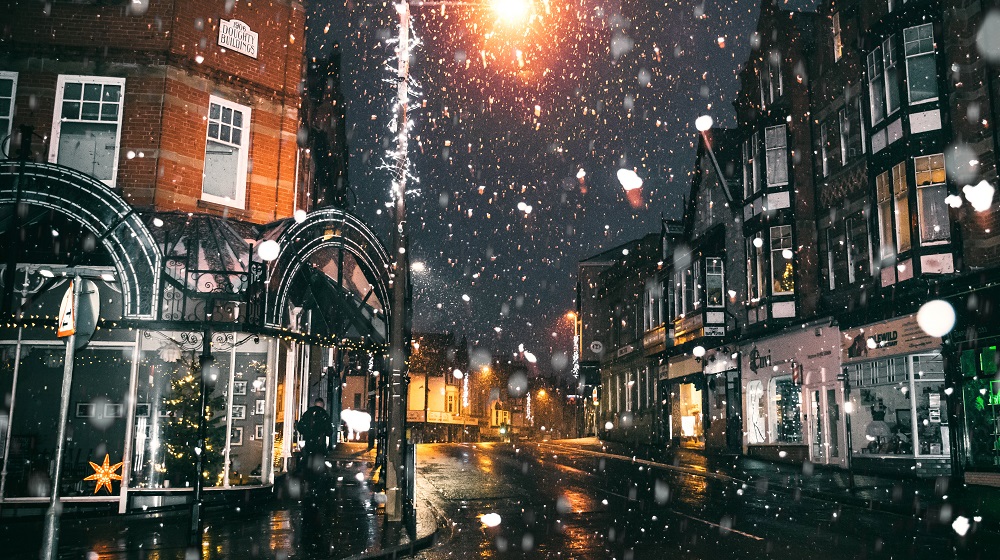 Snow falling on empty street