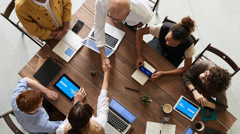 Team meeting at a wooden table