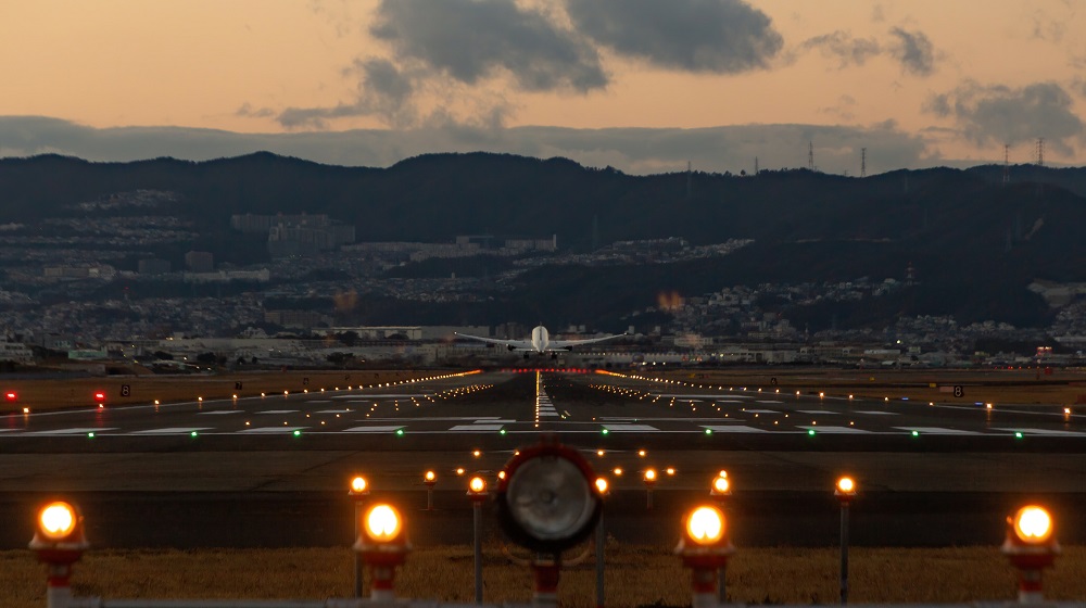 Airplane landing at dusk