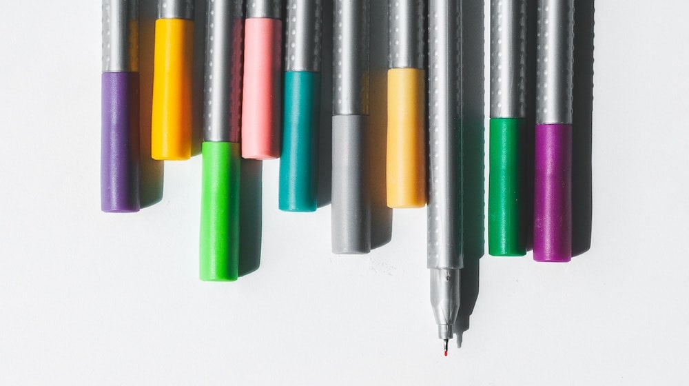 Pens lined up with one open