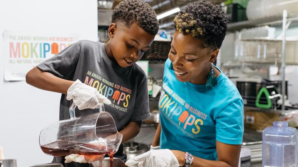 Amber Khan-Robinson and son of Mokipops