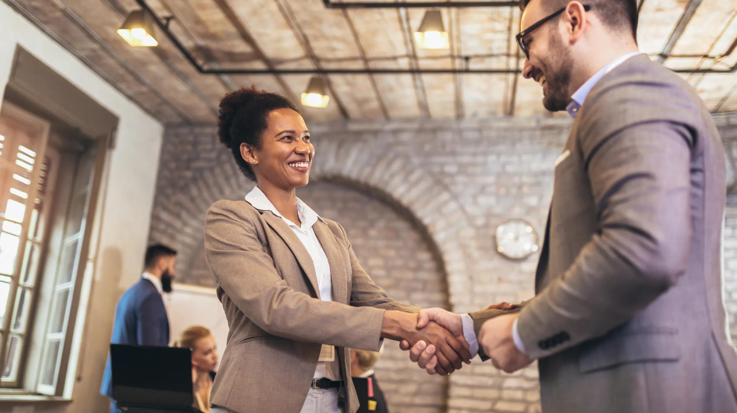 a man and a woman shaking hands