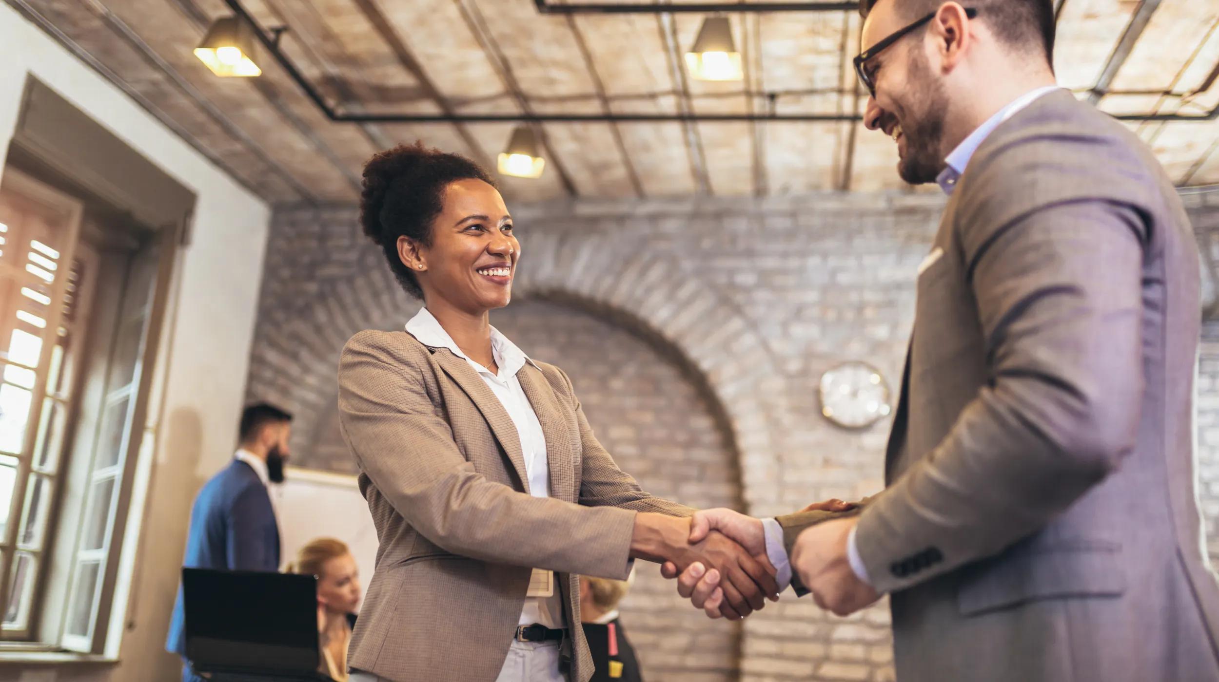 a man and a woman shaking hands