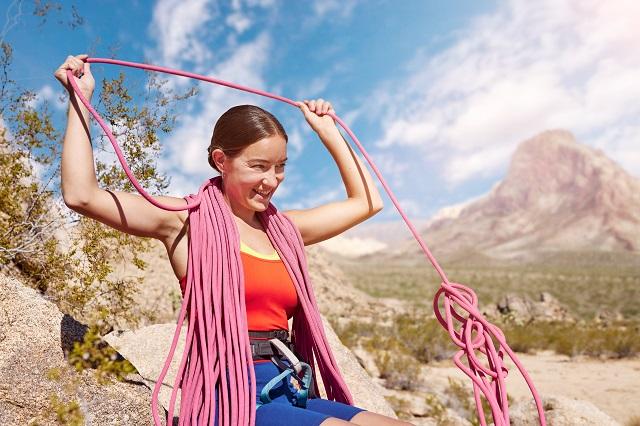 Lizzy VanPatten holding climbing ropes