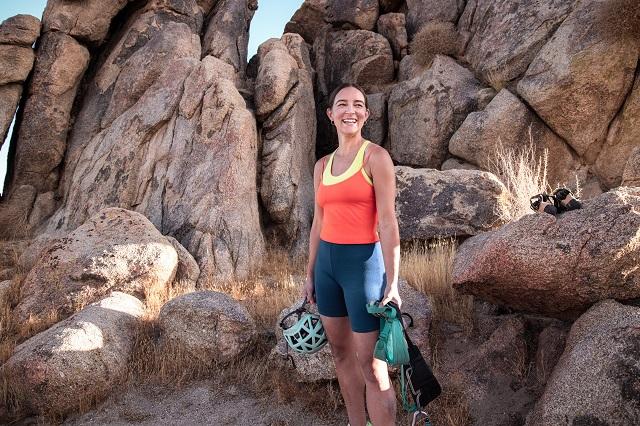 Lizzy VanPatten holding climbing gear