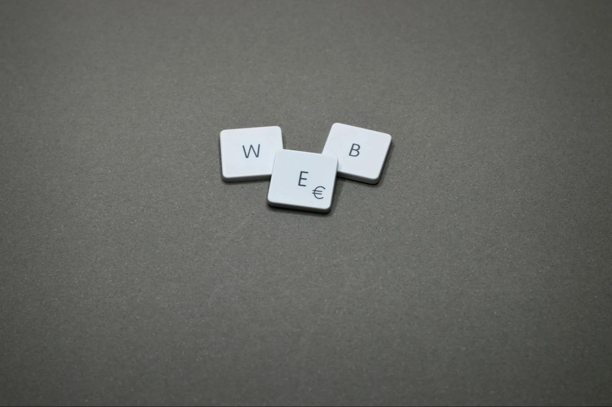 Three Scrabble Tiles Spell the Word Web