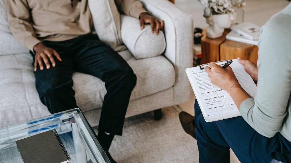 Therapy session between therapist and client
