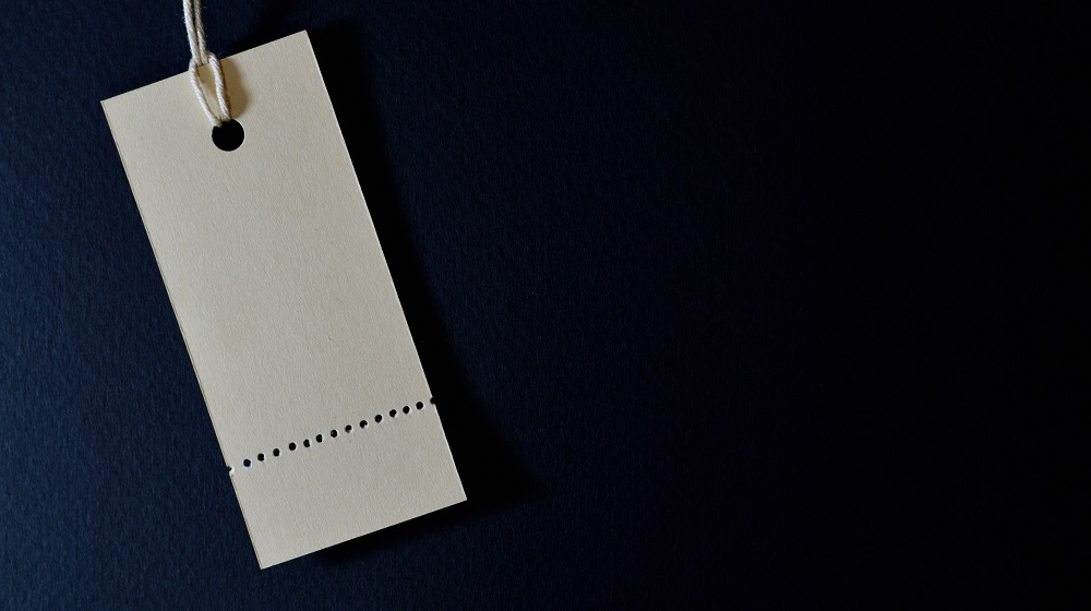 Blank price tag on black blackground