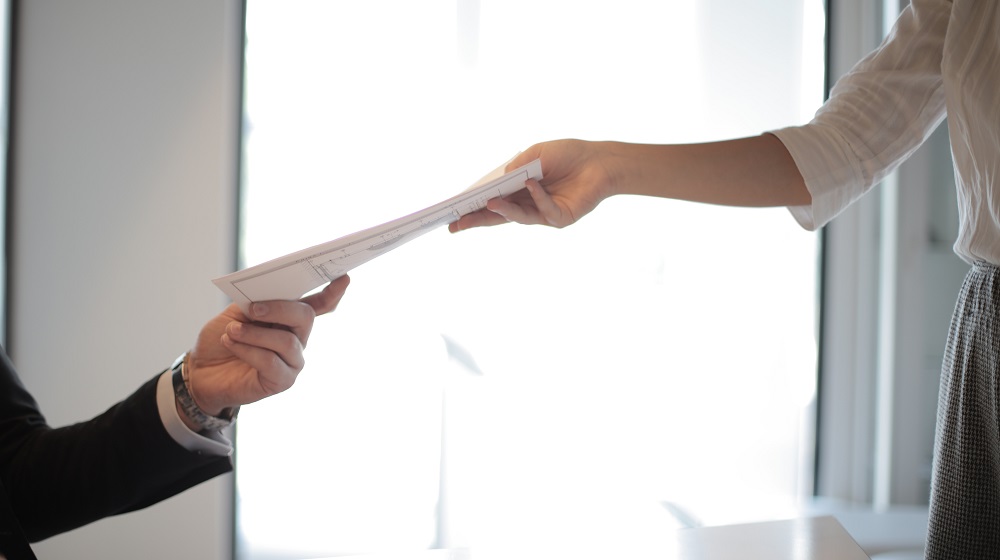 Two people sharing a written document