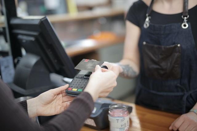 Person making credit card payment at Point of Sale system