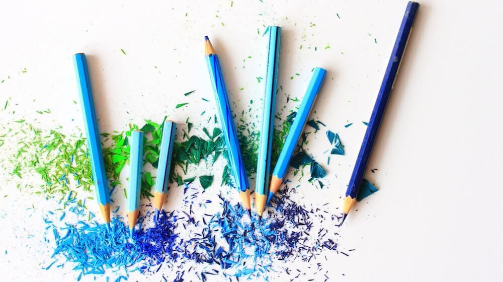 blue colored pencils on white background