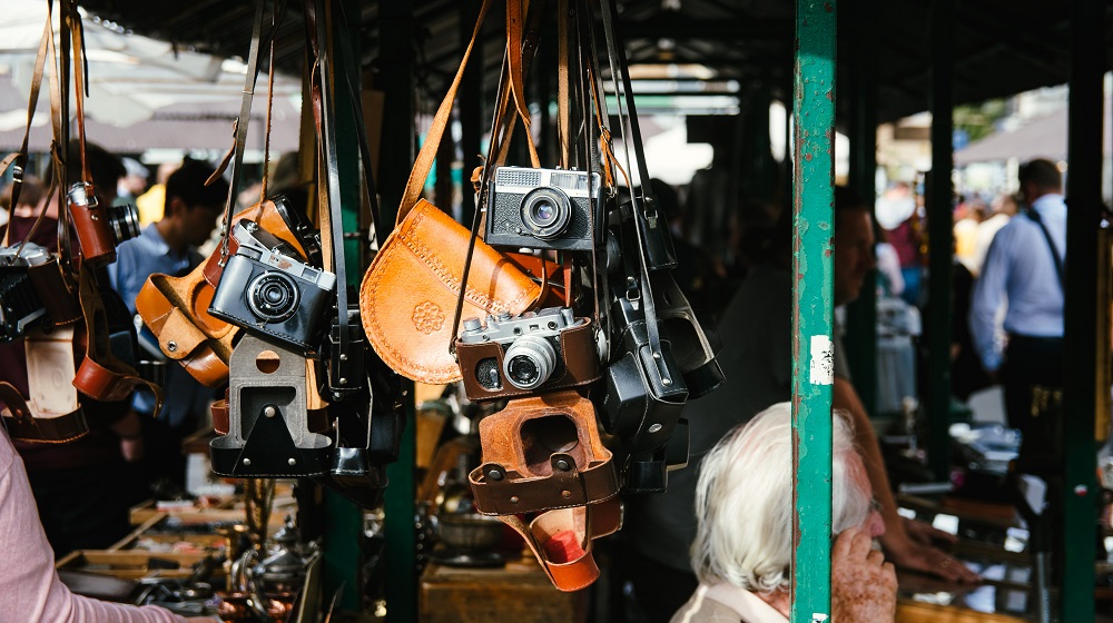 Cameras hanging in a market stand