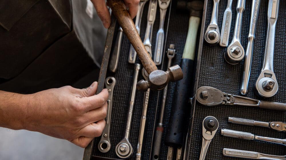 Taking a hammer out of a tool box