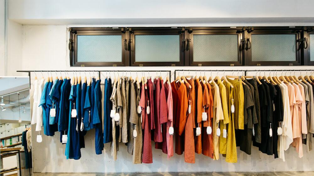Rack of clothes neatly organized by color