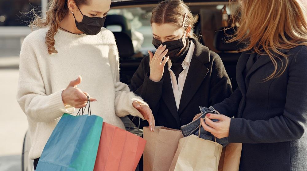 Three women holding shopping bags