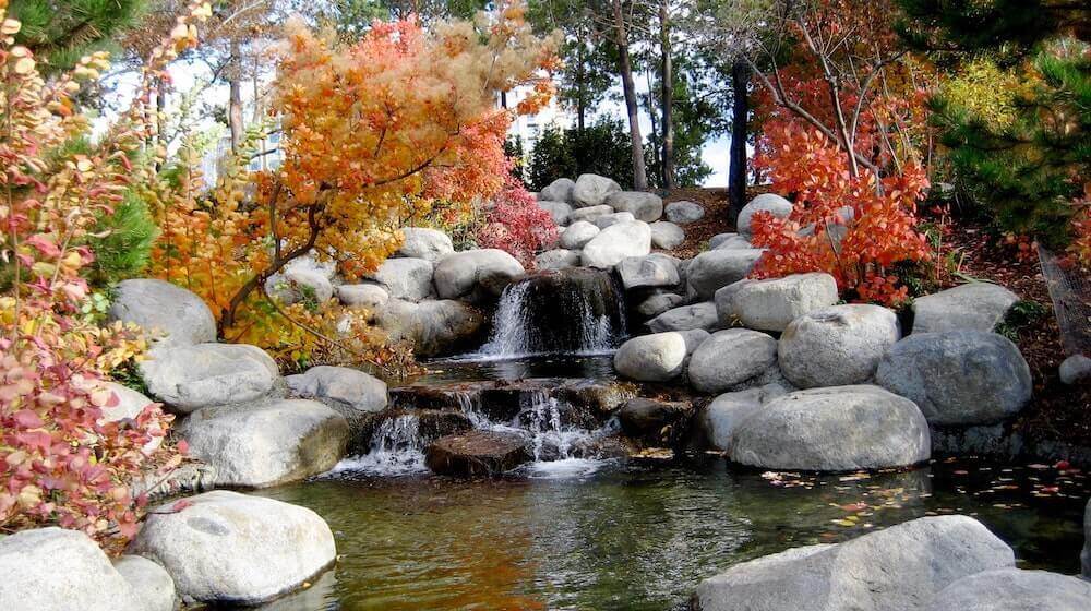 Stream with gray rocks and waterfall