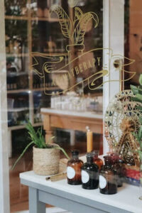 Bottles and plant in window  display