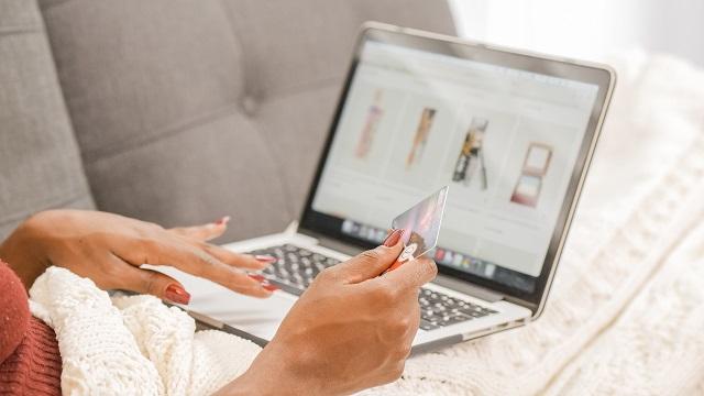 Woman shopping online with laptop