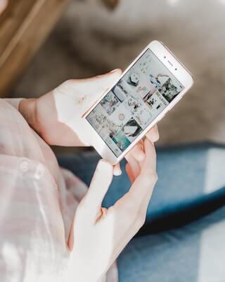 Person looking at Instagram on phone