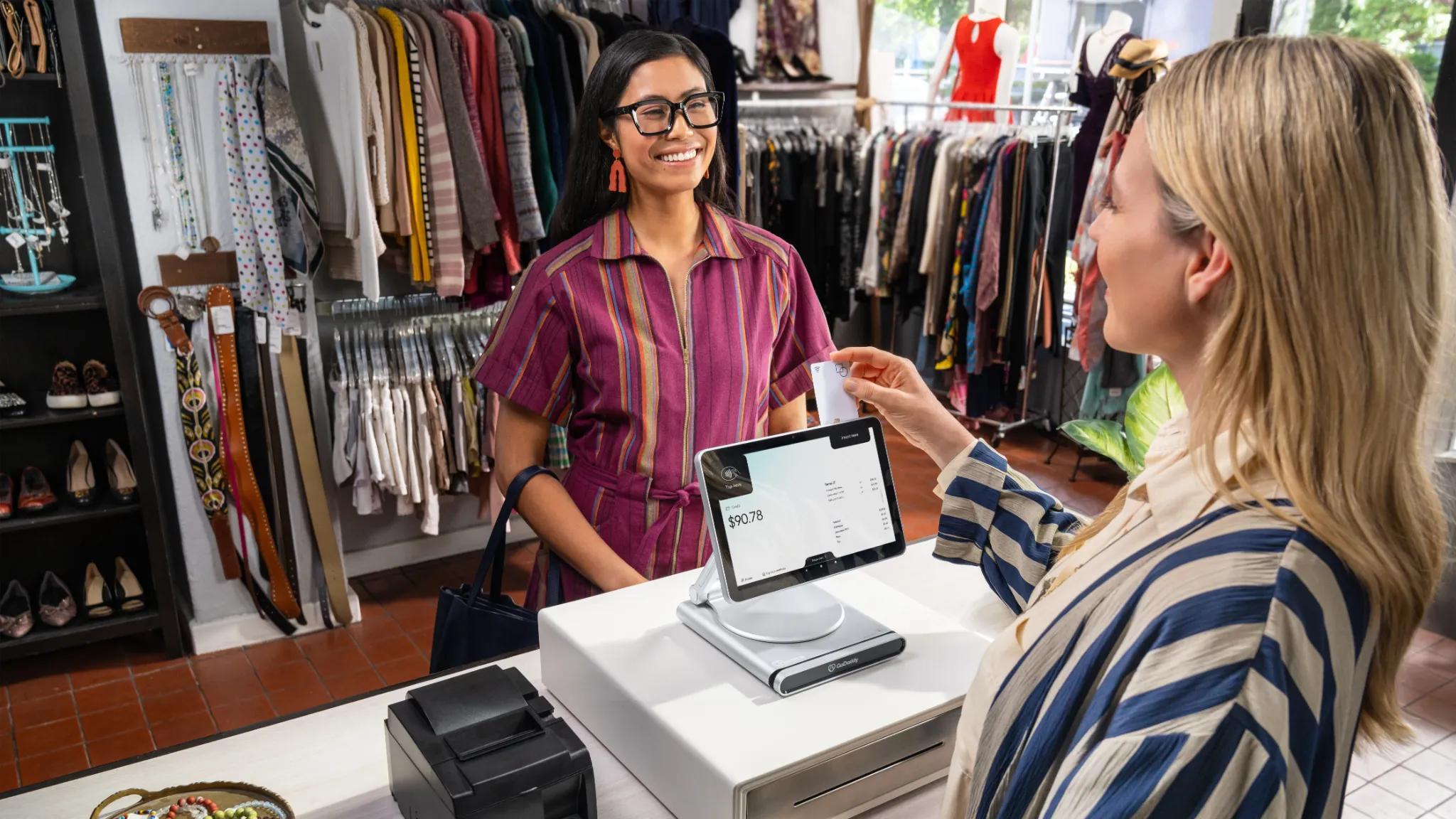Retail store completing payment via POS system.