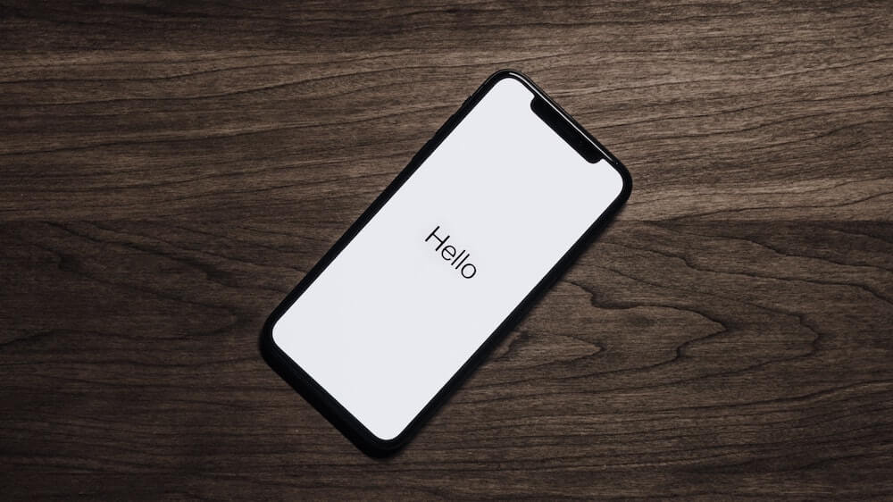 Hello on phone sitting on desk