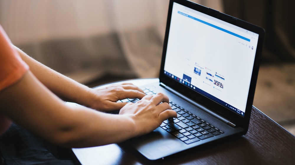 Person using a laptop on a desk