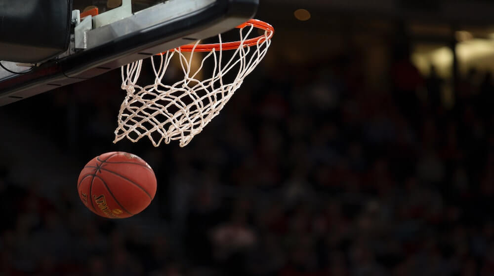 Basketball falling through hoop