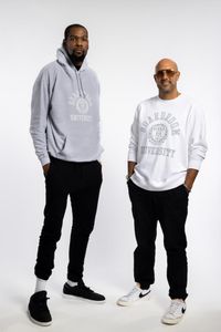 Kevin Durant and Rich Kleiman standing side by side