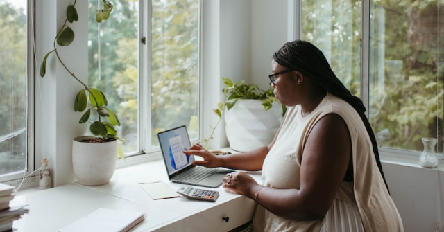 Small business ideas woman writing at desk