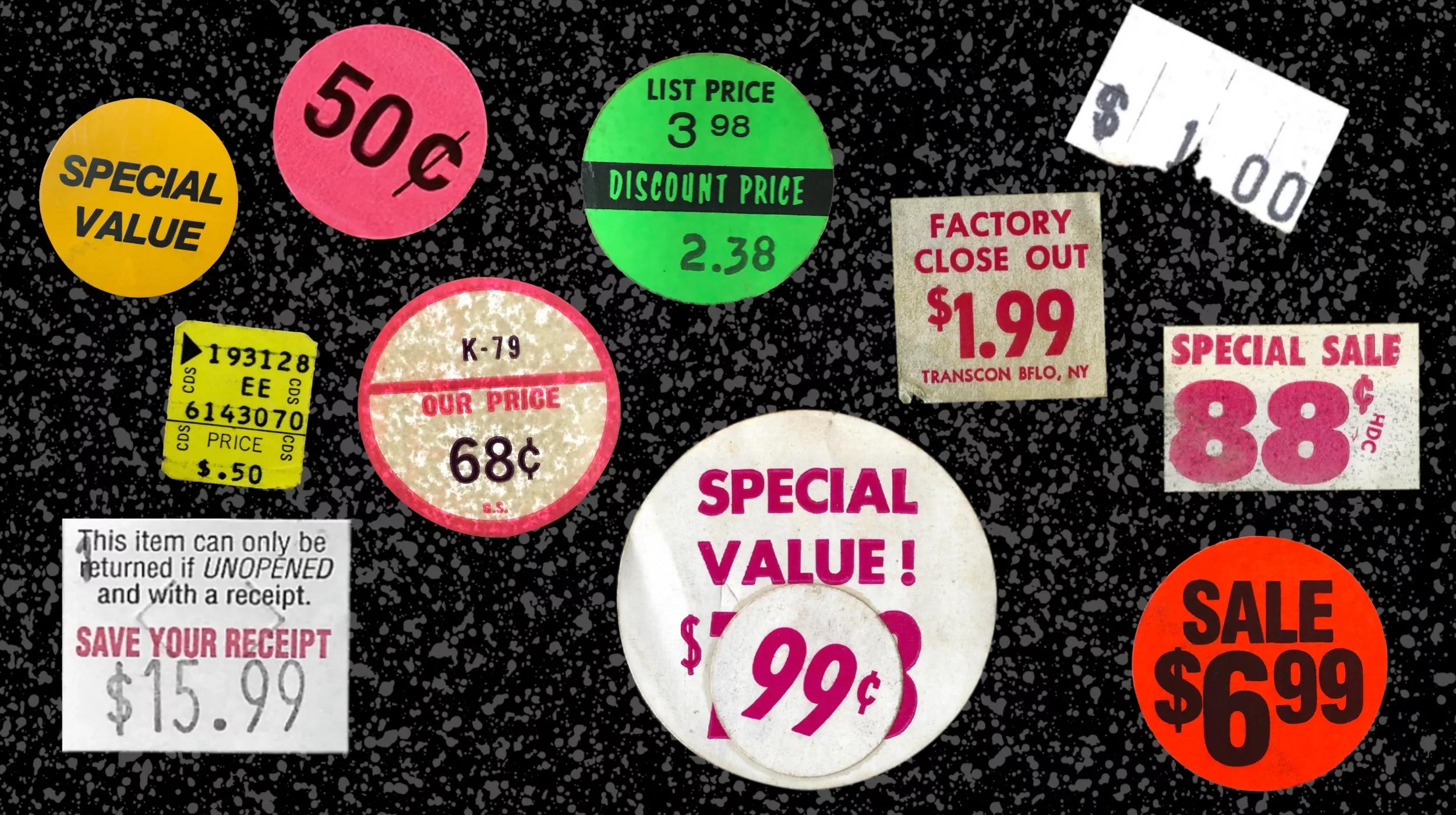 Various pricing stickers scattered over a black background