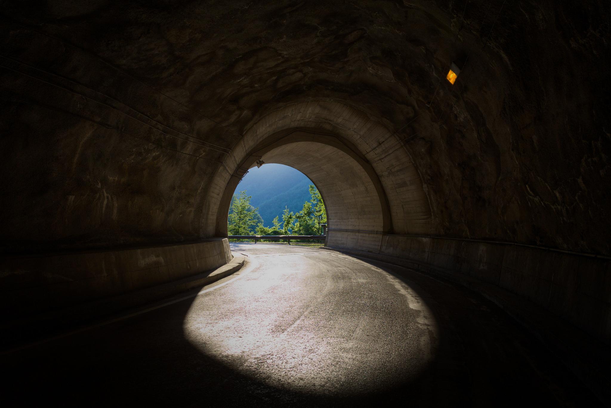 The tunnel exit revealing the daylight's illumination