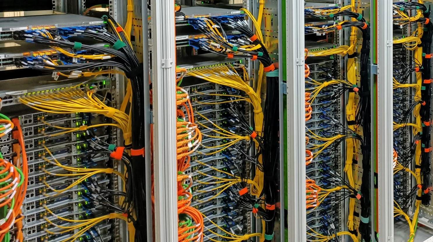 A bunch of wires in a server room