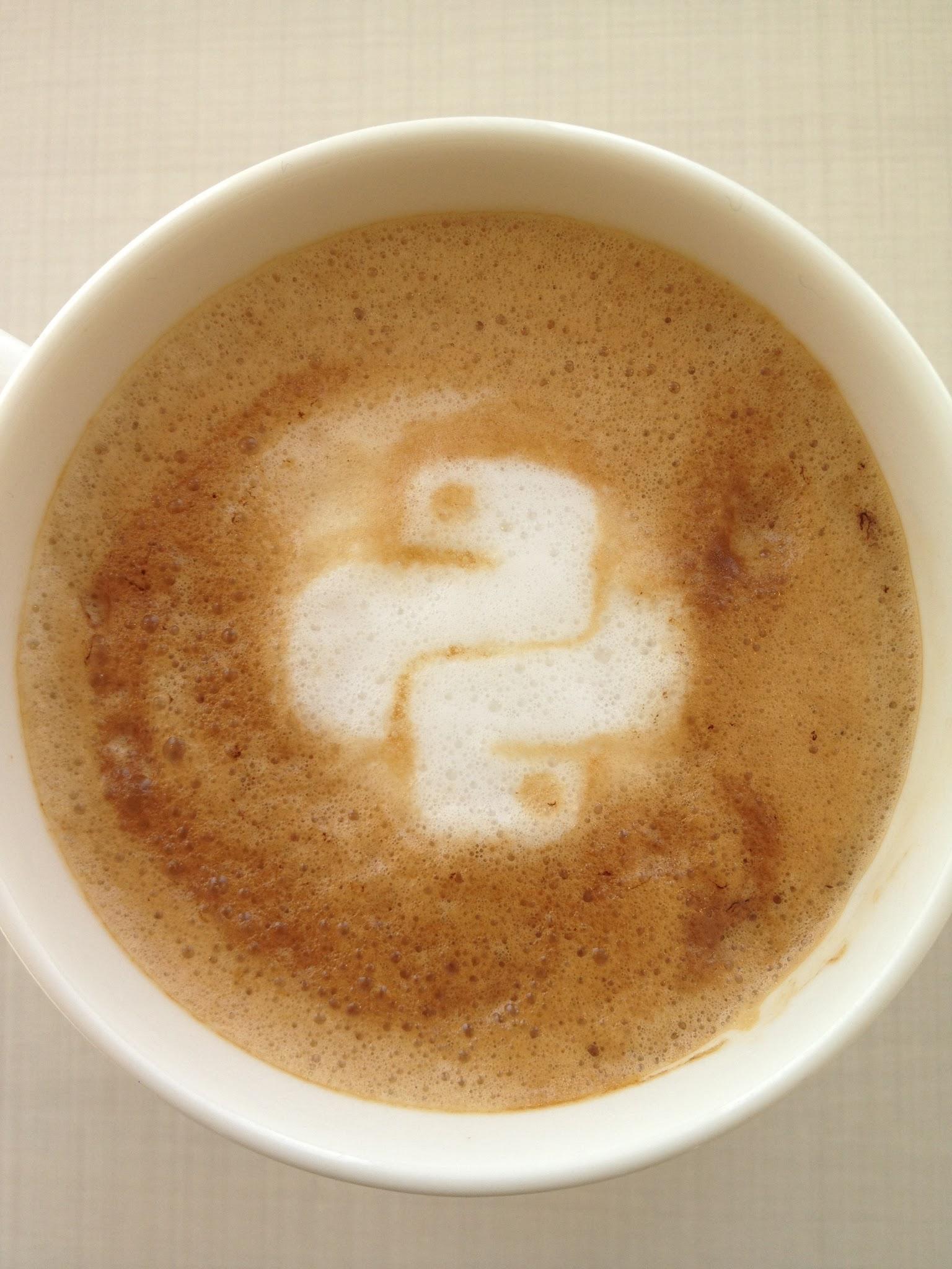 A cup of coffee with a design in the foam