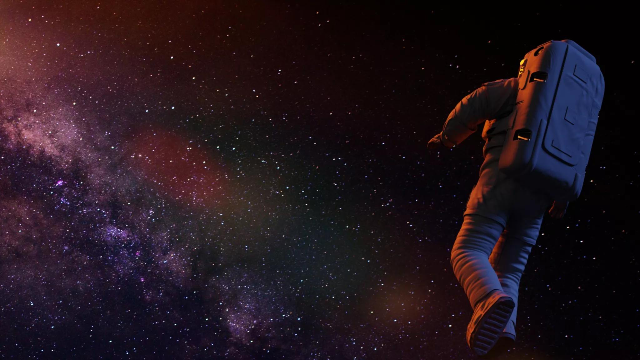 An astronaut floating in space with a vivid starfield and nebula in the background. The astronaut is facing away from the viewer, wearing a full space suit with a large backpack, drifting weightlessly in the cosmos.