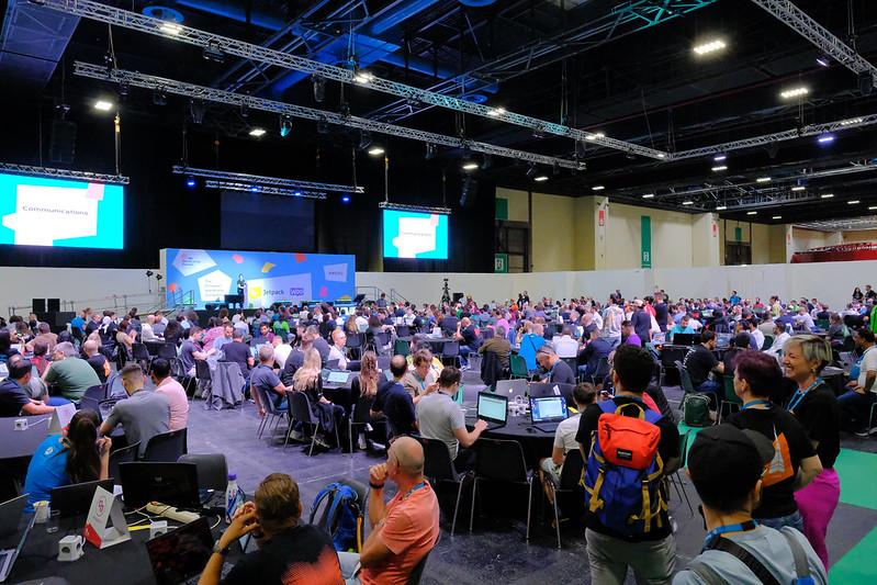 Wide shot of contributor day, showing many tables.