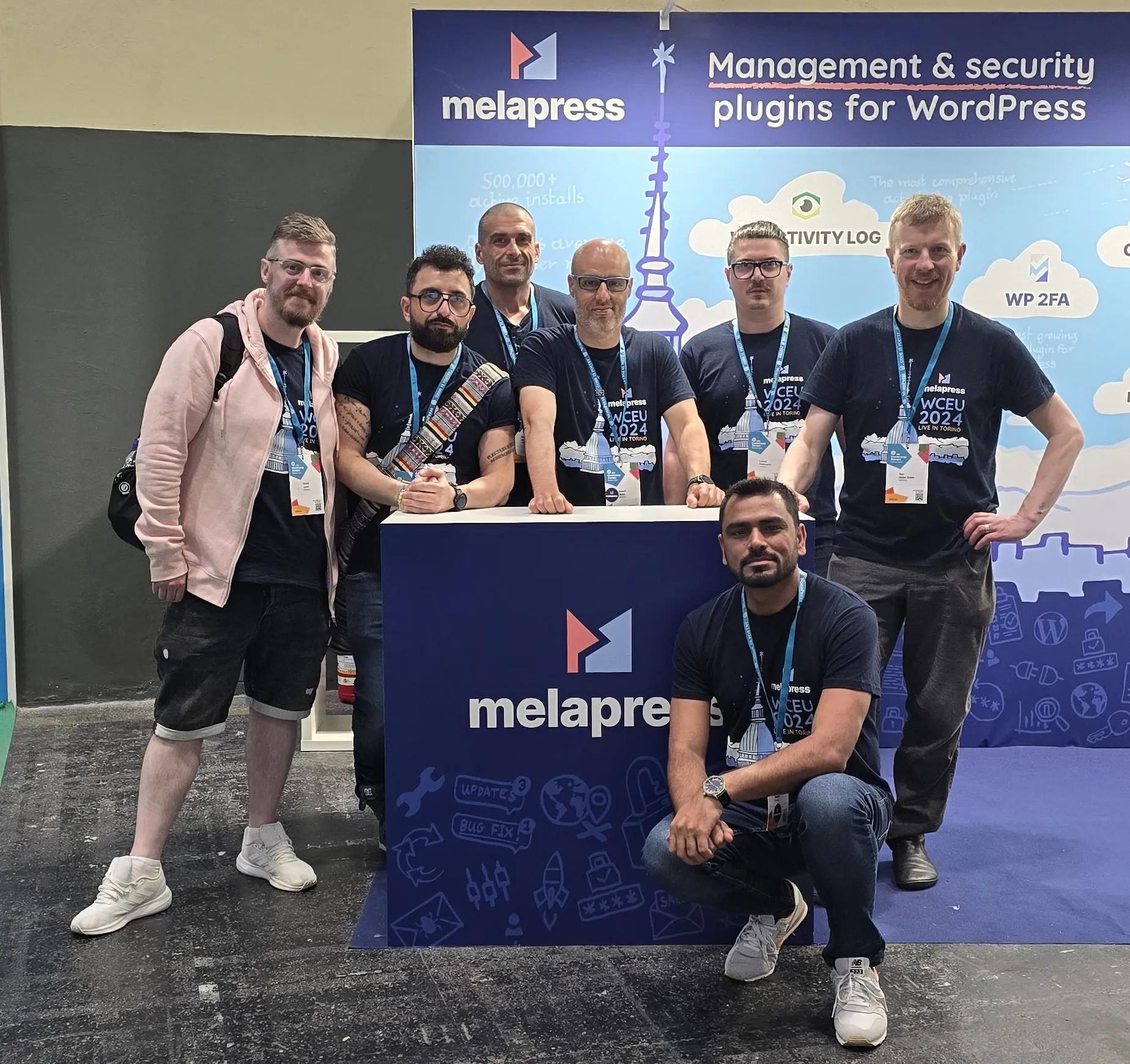 The Melapress team with the fully branded booth at WordCamp Europe 2024 in Torino
