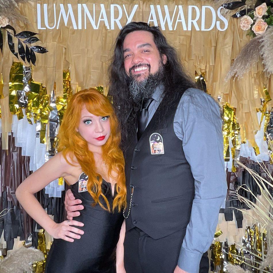 a man and woman posing for a picture