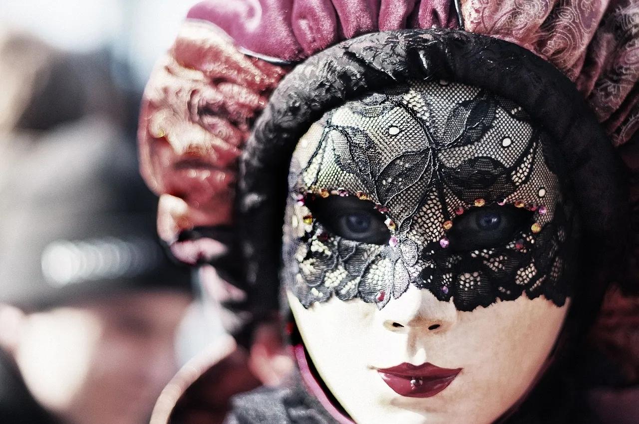 A Woman's Face is Obscured by an Ornate Mask