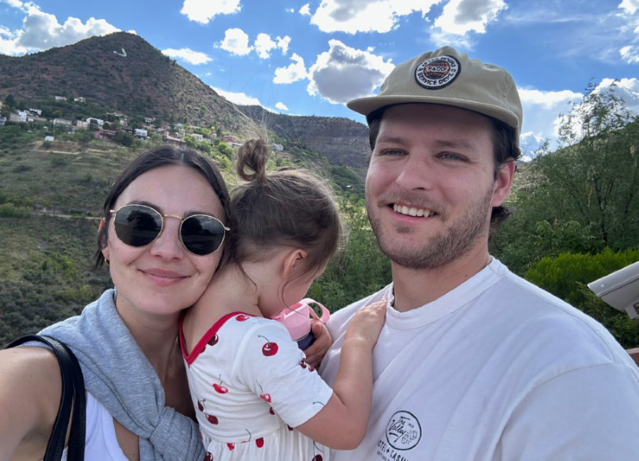 a man and woman with a baby