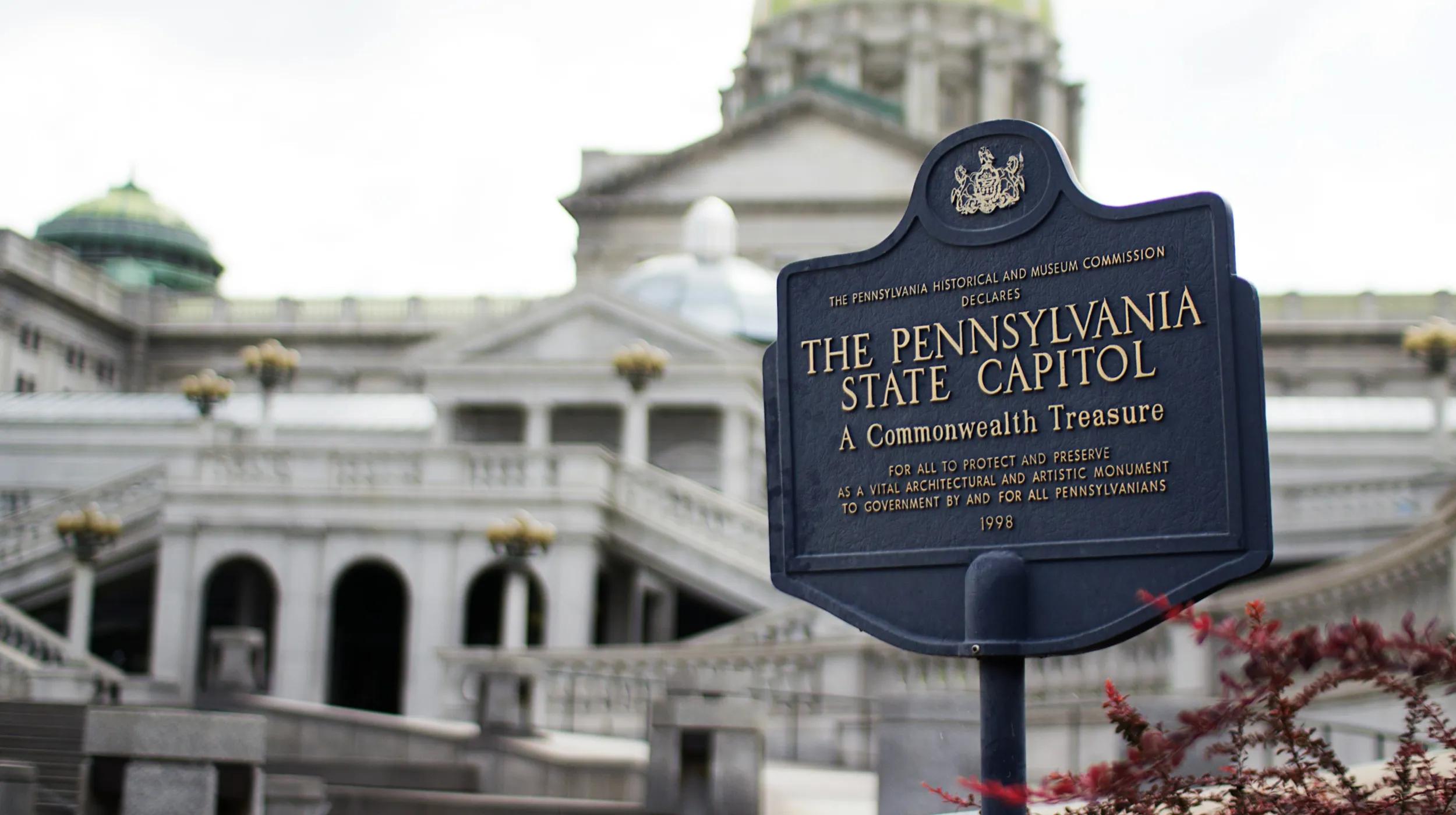 a sign in front of a building - The Pennsylvania State Capitol