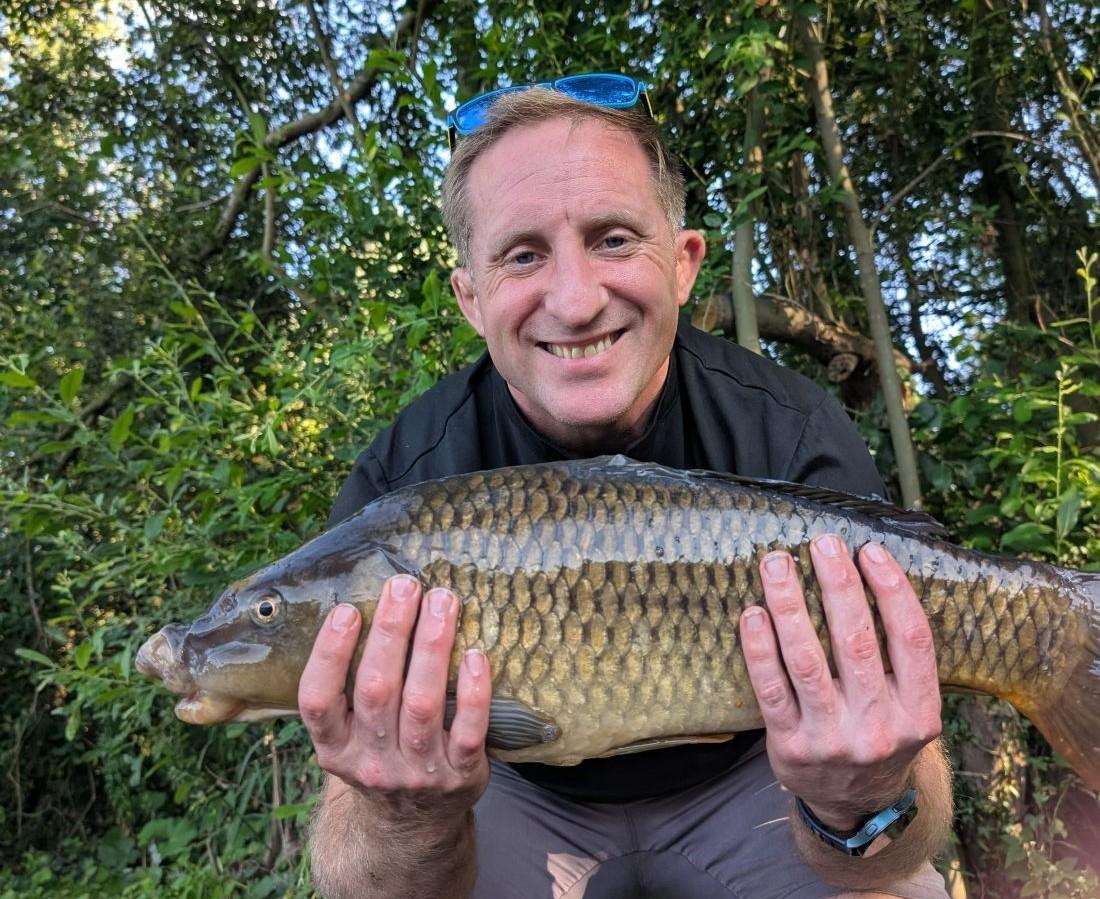 a man holding a fish